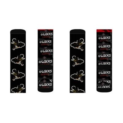 Set of four black socks with distinctive designs, featuring patterns of animal illustrations and branded text.